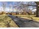 Wide exterior angle of this home showing a long driveway and mature trees at 426 Oakwood Dr, Indianapolis, IN 46260