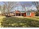 Beautiful brick house with mature trees, well-maintained lawn, and inviting curb appeal at 426 Oakwood Dr, Indianapolis, IN 46260