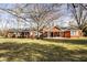 Charming brick home featuring an inviting front yard and covered entrance at 426 Oakwood Dr, Indianapolis, IN 46260