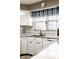 Efficient kitchen features white cabinetry, stainless appliances, and a functional layout for easy cooking at 426 Oakwood Dr, Indianapolis, IN 46260