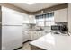 Bright kitchen with white cabinets, stainless steel appliances, and a functional layout for efficient meal preparation at 426 Oakwood Dr, Indianapolis, IN 46260