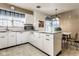 Functional kitchen with white cabinetry, ample counter space, and stainless steel appliances for meal preparation at 426 Oakwood Dr, Indianapolis, IN 46260
