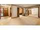 Spacious living room featuring carpet and multiple doorways at 426 Oakwood Dr, Indianapolis, IN 46260