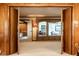 Open doorway showcasing a living room area with built in cabinets, seating and an open area beyond at 426 Oakwood Dr, Indianapolis, IN 46260