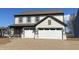 Two-story home featuring a two-car garage, gray siding, and an inviting front porch at 4396 Pine Bluff Dr, Bargersville, IN 46106