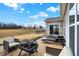 Inviting outdoor patio with comfortable lounge chairs, a fire pit, and scenic backyard view at 4425 Maize Ln, Whitestown, IN 46075
