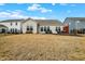 Exterior shot of backyard with patio, outdoor furniture, and grassy area at 4425 Maize Ln, Whitestown, IN 46075