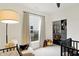Bright Bedroom with a black crib, closet and a comfortable rocking chair illuminated by a lamp at 4425 Maize Ln, Whitestown, IN 46075