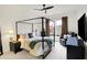 Comfortable main bedroom with a canopy bed, side tables and ceiling fan at 4425 Maize Ln, Whitestown, IN 46075