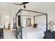 Comfortable bedroom featuring a four-poster bed with ceiling fan and lots of natural light at 4425 Maize Ln, Whitestown, IN 46075