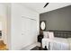 Stylish bedroom with a daybed, mirrored wall decor, and a sliding door closet at 4425 Maize Ln, Whitestown, IN 46075