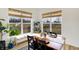 Bright dining area with large windows offers view of wooded backyard at 4425 Maize Ln, Whitestown, IN 46075