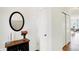 Elegant entryway featuring hardwood flooring, a decorative table, and a stylish mirror at 4425 Maize Ln, Whitestown, IN 46075