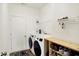 Laundry room with modern appliances, shoe rack and plenty of storage space at 4425 Maize Ln, Whitestown, IN 46075