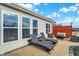 Relaxing backyard patio featuring comfortable lounge chairs, a fire pit, and ample seating at 4425 Maize Ln, Whitestown, IN 46075