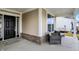 Inviting front porch with seating area, brick accents, and a view of the well-kept yard at 4425 Maize Ln, Whitestown, IN 46075