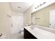 Bathroom featuring a shower-tub combo, a white sink, and a vanity mirror at 4438 Fullwood Ct, Indianapolis, IN 46254