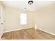 Bedroom featuring new vinyl flooring and a large, bright window at 4438 Fullwood Ct, Indianapolis, IN 46254