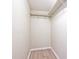 Walk in closet featuring new vinyl flooring and sturdy shelving at 4438 Fullwood Ct, Indianapolis, IN 46254