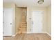 Neutral living space featuring a stairway and a light wood flooring at 4438 Fullwood Ct, Indianapolis, IN 46254