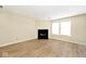 Spacious living room with a black fireplace and new wood flooring at 4438 Fullwood Ct, Indianapolis, IN 46254