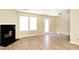 Bright living room with a black fireplace and wood flooring at 4438 Fullwood Ct, Indianapolis, IN 46254