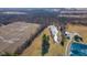 Areal view of the property featuring pond and outbuildings at 4981 E County Road 200 S, Avon, IN 46123