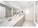 Bright bathroom with dual vanity sinks, a glass shower, and modern fixtures at 4981 E County Road 200 S, Avon, IN 46123
