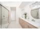 Bright bathroom with dual vanity sinks, a glass shower, and modern fixtures at 4981 E County Road 200 S, Avon, IN 46123
