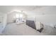 Spacious bedroom featuring a vaulted ceiling, neutral color palette, and comfortable seating at 4981 E County Road 200 S, Avon, IN 46123