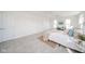 Bright bedroom with neutral carpet, plenty of windows, and light, airy decor at 4981 E County Road 200 S, Avon, IN 46123