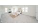 Bright bedroom with neutral carpet, plenty of windows, and light, airy decor at 4981 E County Road 200 S, Avon, IN 46123