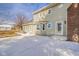 Exterior of home showing a patio area, brick chimney, and yard at 4981 E County Road 200 S, Avon, IN 46123