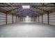 Vast garage area with a high ceiling and open beams, offering a large and versatile space for storage and activities at 4981 E County Road 200 S, Avon, IN 46123