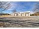 Spacious three-car garage features an extra-wide gravel parking area at 4981 E County Road 200 S, Avon, IN 46123
