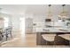 Bright, modern kitchen with white cabinets, stainless steel appliances, and an island with bar seating at 4981 E County Road 200 S, Avon, IN 46123