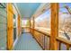 Inviting porch with wood railing and beams, offering scenic views of the surrounding landscape at 4981 E County Road 200 S, Avon, IN 46123