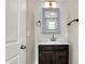 Bathroom features new vanity with hardwood cabinet and modern fixtures at 5053 E Michigan St, Indianapolis, IN 46201