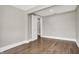 This freshly painted bedroom features hardwood floors and natural light at 5053 E Michigan St, Indianapolis, IN 46201