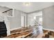 Inviting entryway with a staircase and stylish multi-shade wood floors at 5053 E Michigan St, Indianapolis, IN 46201