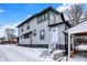 Exterior of a gray two-story house with black trim and a snowy yard at 5053 E Michigan St, Indianapolis, IN 46201