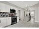 Modern kitchen features stainless steel appliances, granite countertops, and stylish backsplash at 5053 E Michigan St, Indianapolis, IN 46201