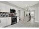 Modern kitchen featuring white cabinets, stainless steel appliances, and a center island at 5053 E Michigan St, Indianapolis, IN 46201