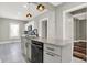 Kitchen island with granite countertop, undermount sink, and stylish pendant lighting at 5053 E Michigan St, Indianapolis, IN 46201