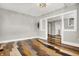 Spacious living room featuring hardwood floors and neutral paint at 5053 E Michigan St, Indianapolis, IN 46201