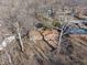 Aerial view of a cozy single-story home surrounded by trees at 5124 Wexford Rd, Indianapolis, IN 46226