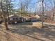 Aerial view of a home surrounded by mature trees on a large lot at 5124 Wexford Rd, Indianapolis, IN 46226