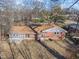 Aerial view of a single-story home with a brick exterior and backyard at 5124 Wexford Rd, Indianapolis, IN 46226