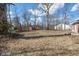 Expansive backyard with mature trees, offering ample space for recreation and outdoor activities at 5124 Wexford Rd, Indianapolis, IN 46226