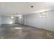 An unfinished basement has painted walls and natural light at 5124 Wexford Rd, Indianapolis, IN 46226
